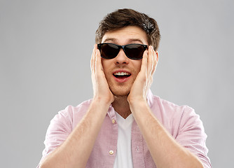 Image showing amazed young man in black sunglasses