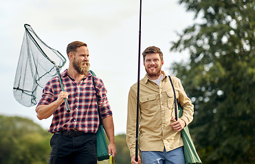 Image showing friends with fishing rods and net outdoors