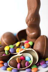 Image showing close up of chocolate bunny, eggs and candy drops