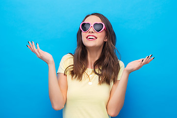 Image showing teenage girl in heart-shaped sunglasses