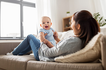 Image showing happy mother with little baby son at home