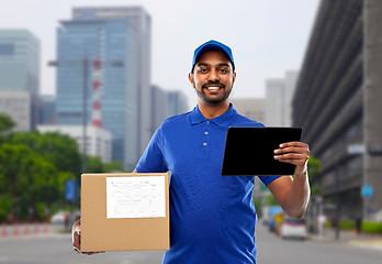 Image showing indian delivery man with tablet pc and parcel box