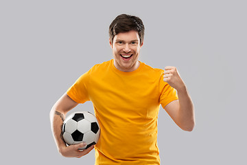 Image showing happy man or football fan with soccer ball winning