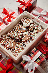 Image showing Delicious fresh Christmas decorated gingerbread cookies placed in wooden crate