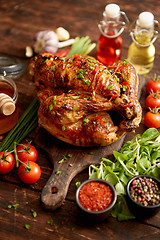 Image showing Roasted whole chicken or turkey served with chilli pepers and chive