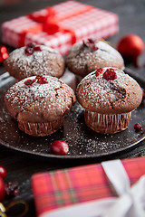 Image showing Christmas chocolate delicious muffins served on black ceramic plate