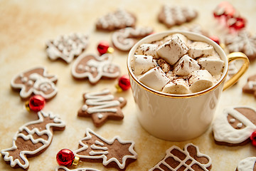 Image showing Cup of hot chocolate and Christmas shaped gingerbread cookies