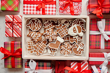 Image showing Delicious fresh Christmas decorated gingerbread cookies placed in wooden crate