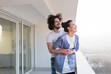 Image showing Couple hugging on the balcony