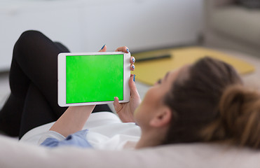 Image showing woman on sofa using tablet computer