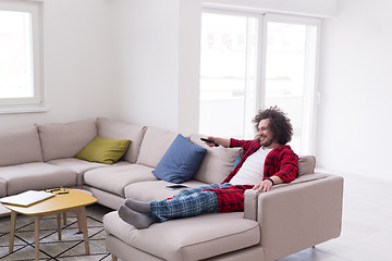 Image showing young man in bathrobe enjoying free time