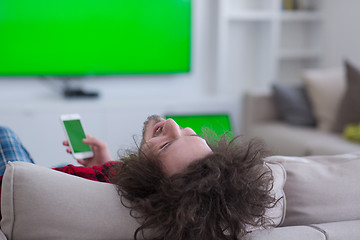 Image showing young man in bathrobe enjoying free time