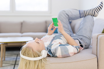 Image showing girl enjoying music through headphones