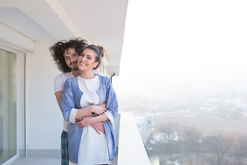 Image showing Couple hugging on the balcony