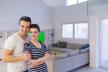 Image showing couple hugging in their new home