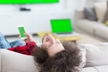 Image showing young man in bathrobe enjoying free time