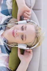 Image showing girl enjoying music through headphones