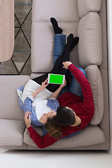 Image showing couple relaxing at  home with tablet computers