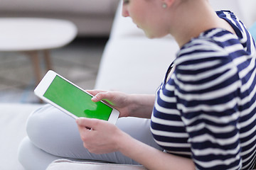 Image showing woman on sofa using tablet computer