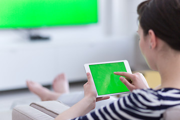 Image showing woman on sofa using tablet computer