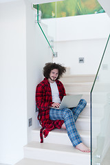 Image showing freelancer in bathrobe working from home