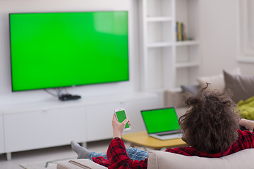 Image showing young man in bathrobe enjoying free time