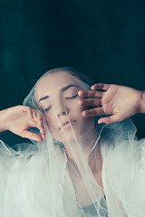 Image showing Beautiful bride looking over her veil