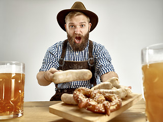 Image showing Germany, Bavaria, Upper Bavaria, man with beer dressed in traditional Austrian or Bavarian costume