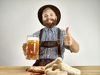 Image showing Germany, Bavaria, Upper Bavaria, man with beer dressed in traditional Austrian or Bavarian costume