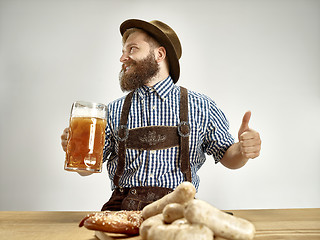 Image showing Germany, Bavaria, Upper Bavaria, man with beer dressed in traditional Austrian or Bavarian costume