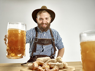 Image showing Germany, Bavaria, Upper Bavaria, man with beer dressed in traditional Austrian or Bavarian costume