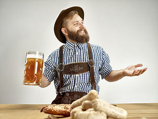 Image showing Germany, Bavaria, Upper Bavaria, man with beer dressed in traditional Austrian or Bavarian costume