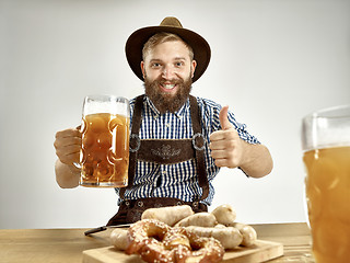 Image showing Germany, Bavaria, Upper Bavaria, man with beer dressed in traditional Austrian or Bavarian costume