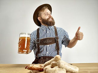 Image showing Germany, Bavaria, Upper Bavaria, man with beer dressed in traditional Austrian or Bavarian costume