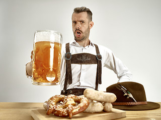 Image showing Germany, Bavaria, Upper Bavaria, man with beer dressed in traditional Austrian or Bavarian costume