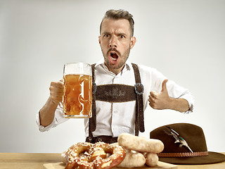 Image showing Germany, Bavaria, Upper Bavaria, man with beer dressed in traditional Austrian or Bavarian costume