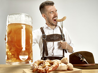 Image showing Germany, Bavaria, Upper Bavaria, man with beer dressed in traditional Austrian or Bavarian costume