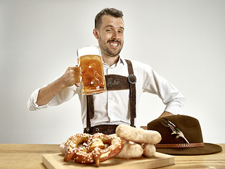 Image showing Germany, Bavaria, Upper Bavaria, man with beer dressed in traditional Austrian or Bavarian costume