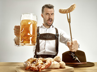 Image showing Germany, Bavaria, Upper Bavaria, man with beer dressed in traditional Austrian or Bavarian costume