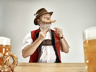 Image showing Germany, Bavaria, Upper Bavaria, man with beer dressed in traditional Austrian or Bavarian costume