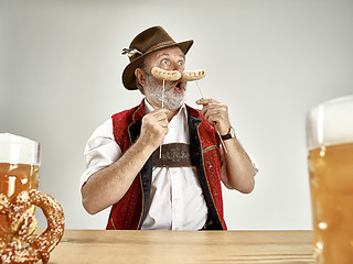 Image showing Germany, Bavaria, Upper Bavaria, man with beer dressed in traditional Austrian or Bavarian costume