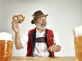 Image showing Germany, Bavaria, Upper Bavaria, man with beer dressed in traditional Austrian or Bavarian costume