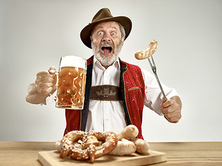 Image showing Germany, Bavaria, Upper Bavaria, man with beer dressed in traditional Austrian or Bavarian costume