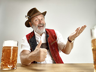 Image showing Germany, Bavaria, Upper Bavaria, man with beer dressed in traditional Austrian or Bavarian costume