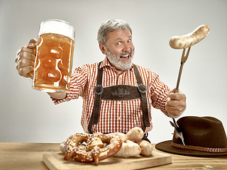 Image showing Germany, Bavaria, Upper Bavaria, man with beer dressed in traditional Austrian or Bavarian costume