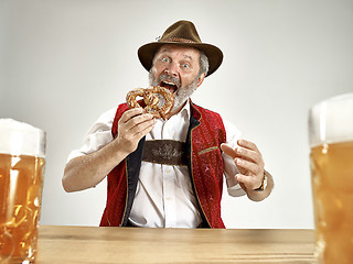 Image showing Germany, Bavaria, Upper Bavaria, man with beer dressed in traditional Austrian or Bavarian costume