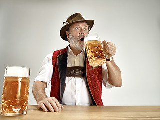 Image showing Germany, Bavaria, Upper Bavaria, man with beer dressed in traditional Austrian or Bavarian costume