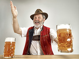 Image showing Germany, Bavaria, Upper Bavaria, man with beer dressed in traditional Austrian or Bavarian costume