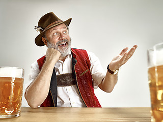 Image showing Germany, Bavaria, Upper Bavaria, man with beer dressed in traditional Austrian or Bavarian costume