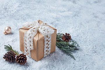 Image showing christmas gift on snowy background